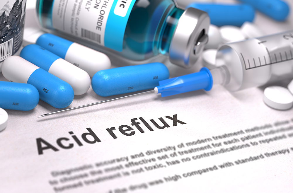 Diagnosis - Acid Reflux. Medical Concept with Blue Pills, Injections and Syringe. Selective Focus. Blurred Background.