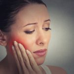 What is a periapical abscess in a tooth? Is it serious?